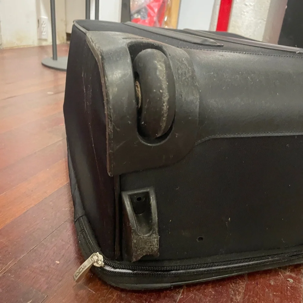 Tumi Black Rolling Suitcase